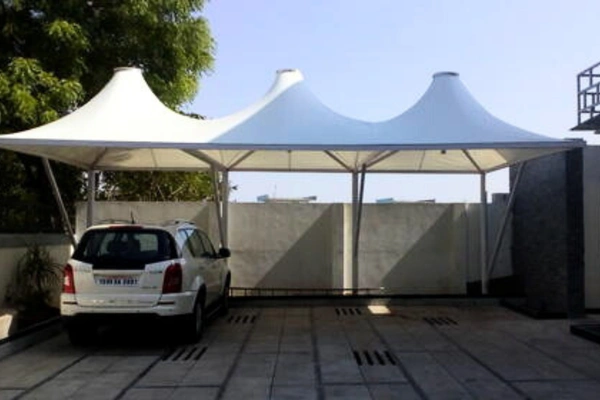 ShadeCo residential shade structure, a stylish tensile canopy for car parking or garden, enhancing home comfort and aesthetics.