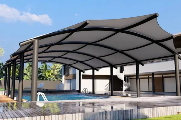 ShadeCo swimming pool sun shed, a stylish UV-protective tensile shade sail covering a pool area, blending modern design with durable functionality.