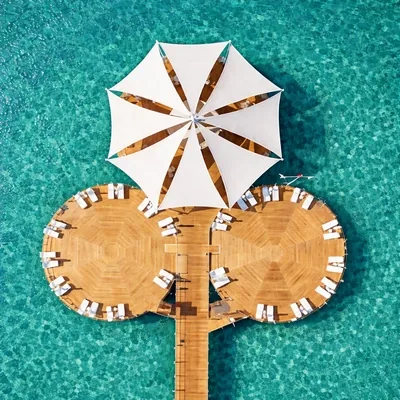 Modern architectural shade sails by ShadeCo for resort and commercial outdoor spaces