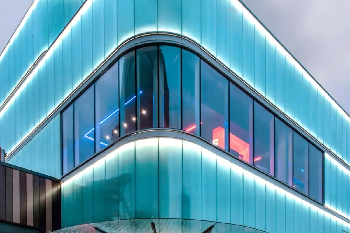 Inside a large hangar, a private jet is parked, highlighting the design of ShadeCo's prefabricated steel structures.