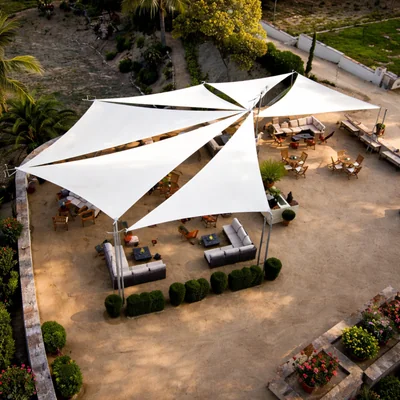 Outdoor seating shade sails installed for restaurant café and resort seating areas