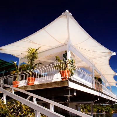Terrace shade sails installed on rooftop terrace for outdoor sun protection