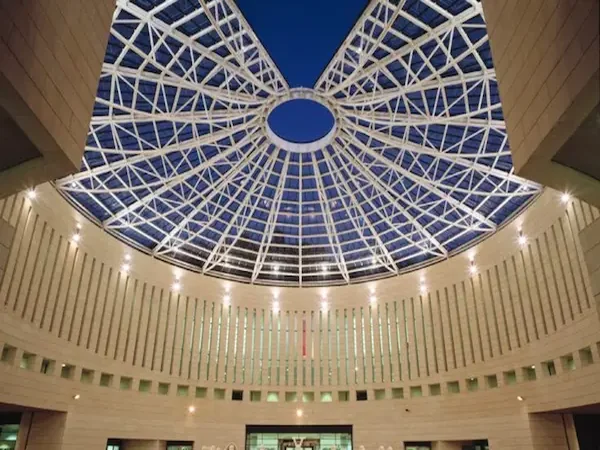 Atrium tensile roof structure by ShadeCo for modern building architecture