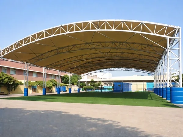 Playground tensile shade structure by ShadeCo for children's outdoor play areas