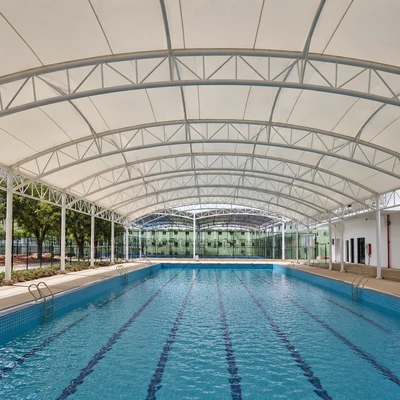 Swimming pool shade structure for sun protection and user comfort